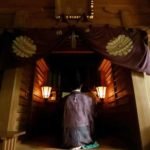 A Shinto priest holding a ritural ceremony at Okitsugu shrine of the Munakata Taisha in Okinoshima island, some 60 kilometres from Munakata city, Fukuoka prefecture. (Photo: AFP)