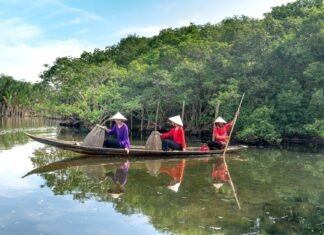 women on a wooden boat