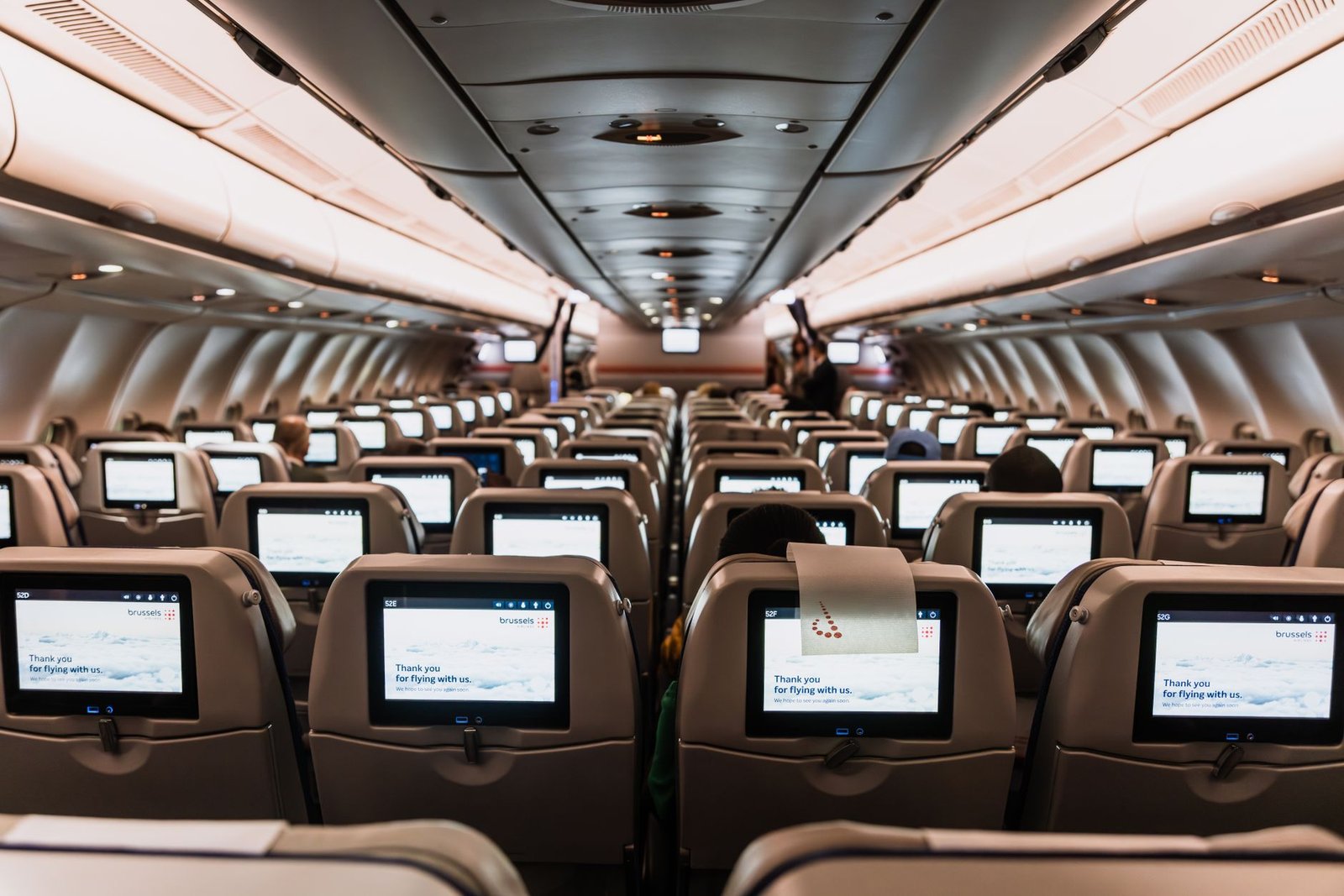 Who picks the movies you watch at 35,000ft? 2 seats with screens in airplane
