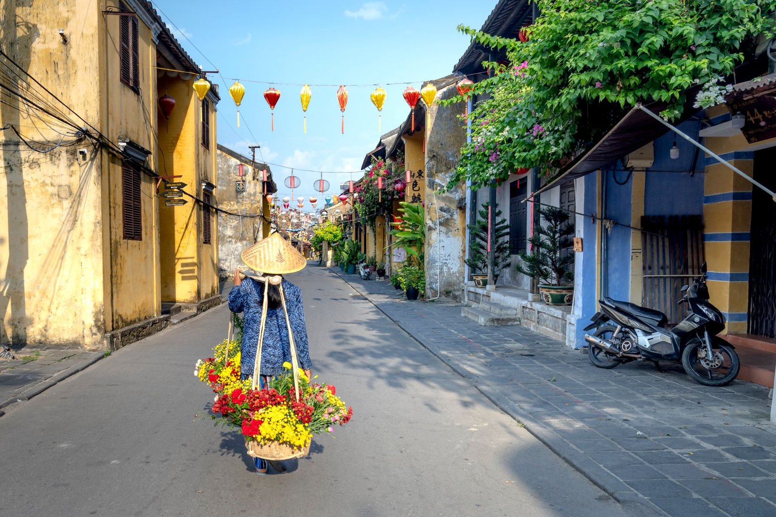 Vietnam Winter Travel 2026: Ride the Flight Surge From Hanoi to Da Nang 3 a person using a carrying pole